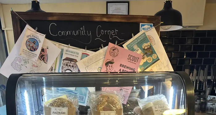 Our Community Corner board, covered in posters for local shows and events